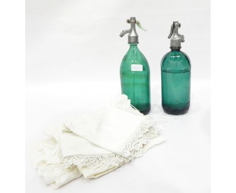 Two soda syphons, green glass, one marked Budapest to metal top, Victorian cushion covers 