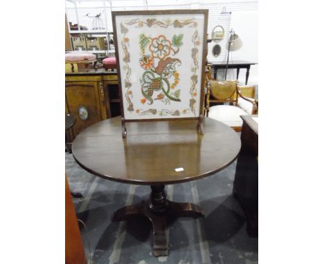 Oak circular extending dining table on single turned stem and quartet base with single leaf, 112cm diameter and an embroidere