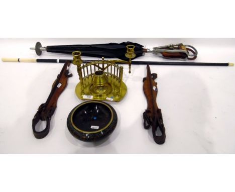 Victorian brass inkstand modelled with central inkwell within a semi circular gallery, with two hinged candle sconces and pen