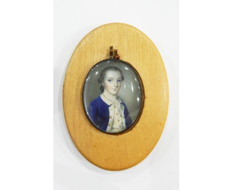 18th century portrait miniature on ivory of a young man in a blue coat, in gilt metal glazed two-sided pendant frame, 4.5cm x