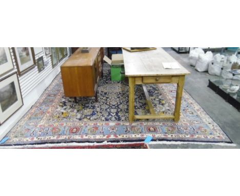 Large Mashad Persian carpet, the blue ground with central peach guls surrounded by foliate motifs, having pale blue frieze bo