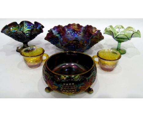 Large carnival glass punch bowl and cups decorated with fruiting vines, various other examples of carnival glass decorated wi