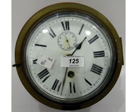 Ship's clock, the enamel dial with Roman numerals and subsidiary seconds dial, in brass case, on wooden wall mount 