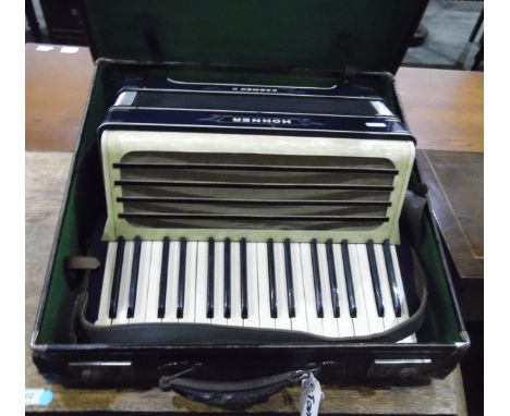 Carmen II accordion made by Hohner within its original leather case 