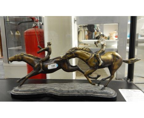 20th century bronzed-finish polo group of two riders on a metal base, 62cm long x 33cm high (one polo stick loose) 