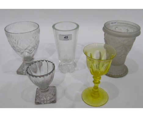 Late 18th/early 19th century drinking glass, the bowl with wavy rim, cut decoration, on squat knopped stem and square lemon s