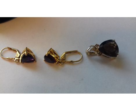 Pair of silver-gilt and amethyst-coloured drop earrings, each set triangular single stone and a silver and quartz pendant (2)