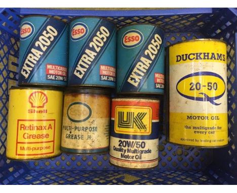 A selection of Esso, Shell and Duckham's Oil cylindrical canisters.