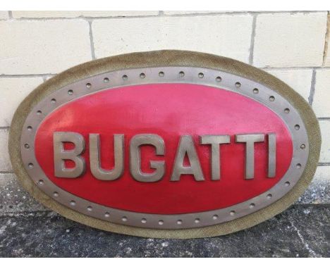 An oval Bugatti showroom sign, 37 x 23".