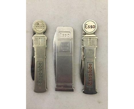 Three Esso penknives in the shape of petrol pumps.