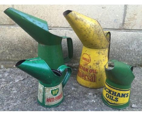 Four assorted oil measures including Shell, BP and Duckhams.