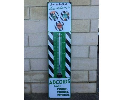 A Duckham's Adcoids Black and White enamel thermometer in good condition, 11 x 45 1/2".
