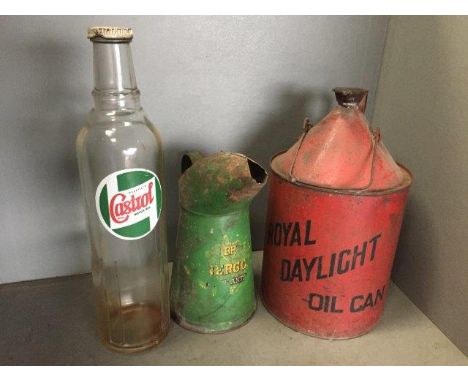 A Royal Daylight Oil can, a BP Energol oil measure and a Castrol oil bottle.