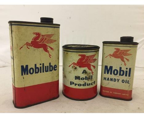 Three Mobil oil cans.