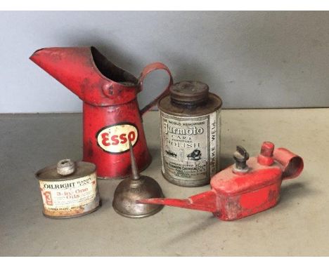 An Esso half pint oil measure, a Jurmoto car polish can, an Oilwright 3-in-1 oil can and two others.
