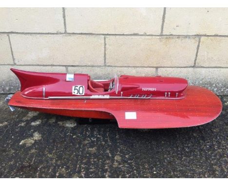 A good quality scale model of a Ferrari speedboat with decals, one marked Lando Del'orto.