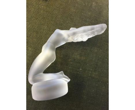 A Lalique frosted glass mascot/desk piece depicting a stylised female nude leaning back, signed to the base Lalique France an