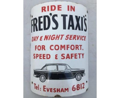 An unusual curved enamel advertising sign - Ride in Fred's Taxi's, Day and Night Service for Comfort, Speed and Safety Teleph