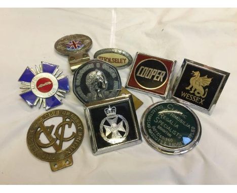 A collection of assorted car badges to include a part enamel California Sports Car Club badge, Veteran Car Club of Great Brit