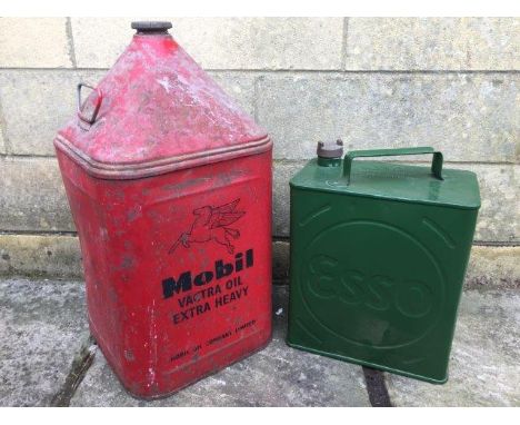 A Mobil Vactra Oil Extra Heavy five gallon pyramid can and an Esso two gallon petrol can.