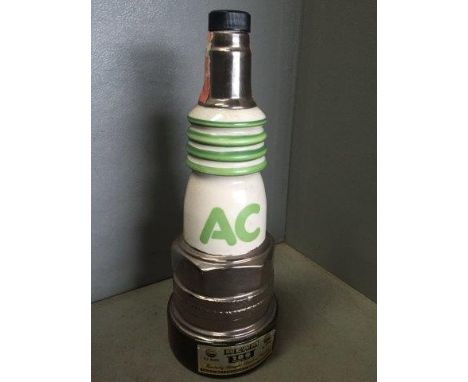 An AC Plugs decanter in the form of a Jim Beam bourbon decanter dated 1977 to the base. 