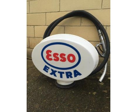 An Esso Extra plastic petrol pump globe and a petrol pump hose with nozzle.