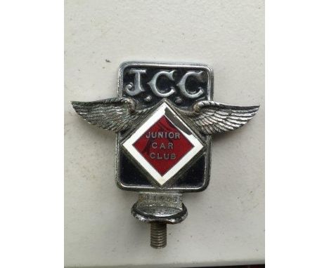 A Junior Car Club part enamel badge.