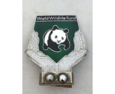 A World Wildlife Fund part enamel car badge.