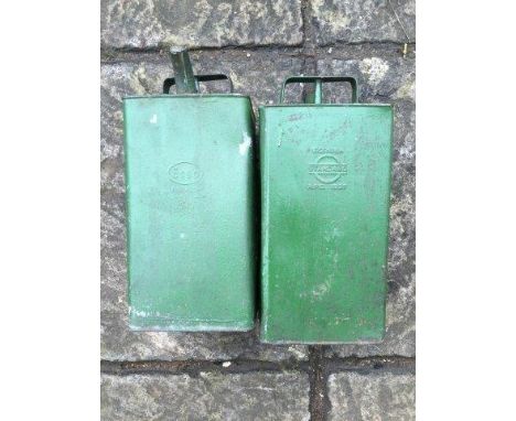 Two oil cans, one stamped Standard Oil 1937, the other Esso 1949.