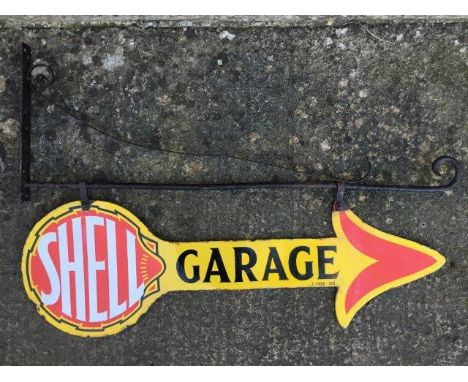 A good and rare Shell Garage double sided enamel arrow sign on an early metal bracket, with some professional restoration to 