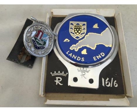 A Lands End Car Club badge and one smaller partially enamel marked Safety First.