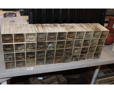 A set of screw tidy drawers and contents. Postage unavailable 