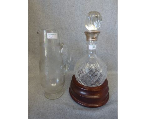 Hallmarked silver collar cut glass decanter on mahogany stand & Edwardian water jug
