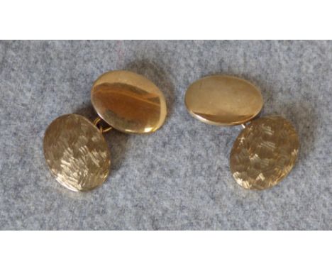 Pair of 9 carat gold cufflinks with one textured oval panel and one plain, 13g gross