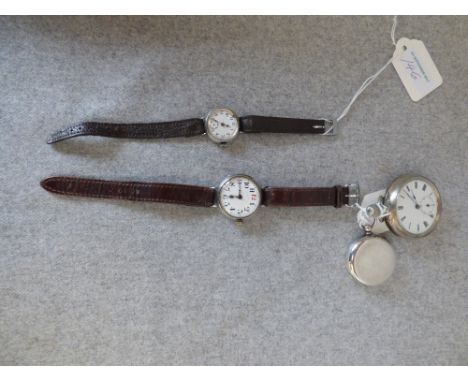 A silver wrist watch, import mark for 1914, with a bar movement cylinder escapement movement, enamel dial, on a strap; with a