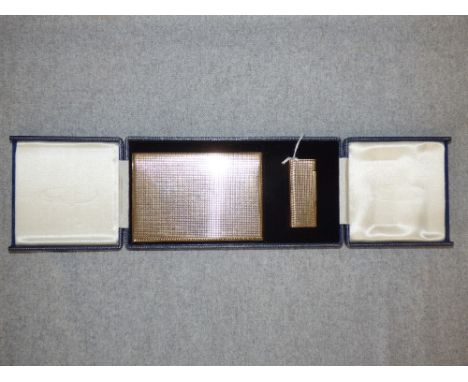 9 carat gold 'slide action' cigarette case, 12.5 x 8.5 cm, 175g; with a matching 9 carat gold cigarette lighter in a fitted c