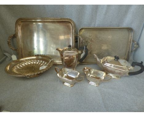 A silver plated four piece tea service; a two handled tray; a two handled rectangular gallery tray and a swing handled bread 