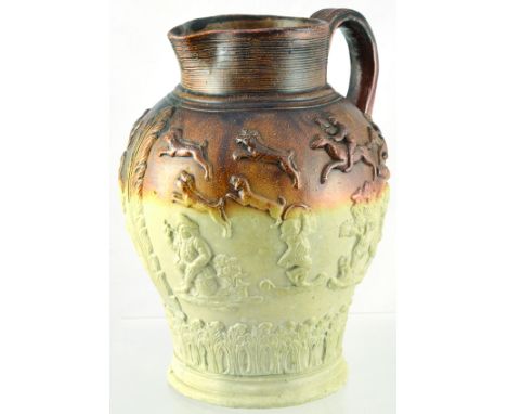 MORTLAKE? SALT GLAZE JUG. 9ins tall, brown top, lower off white salt glaze with raised hunting motifs around shoulder, drinke
