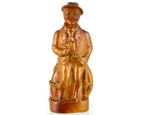 SAILOR FLASK. 8.5ins tall. Overall mid tan salt glaze full figural flask formed as a sailor holding a pipe anchor by his feet