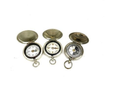 A WWI Sherwood &amp; Co London compass stamped V No 34444 1915 and broad arrow diameter 4.5cm, together with two other WWI co
