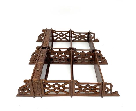 A pair of Chinese Chippendale style mahogany hanging shelves with fretwork side panels three tiers and two drawers carved in 