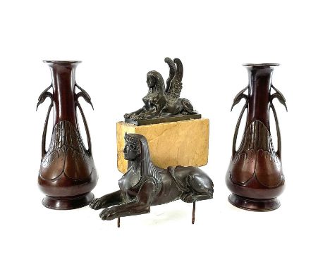 A bronze sphinx figure length 19cm together with a winged sphinx on a marble base and a pair of bronze vases with twin crane 