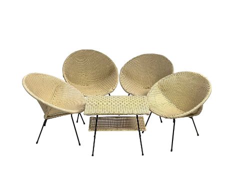 Four mid-century Italian plastic woven chairs on wire frames together with a matching two tier coffee table.The wire frames a