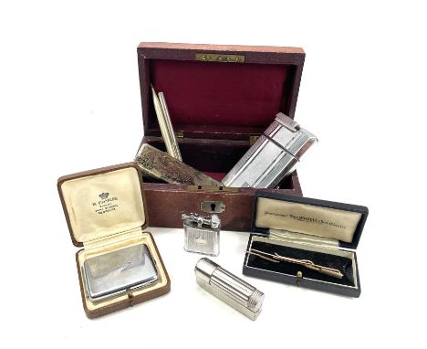 A cigarette case with attached lighter monogrammed N L R together with a Swank arrow tie clip, Gillette gilt razor set in a c