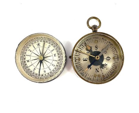 A 19th century nickel compass with a printed card dial and a cover, diameter 5cm together with a brass compass. (2)