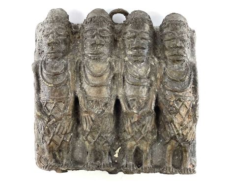 A Benin bronze plaque, cast in relief with four figures, height 18cm.