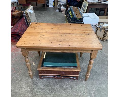 A pine rectangular kitchen table, raised on turned legs, height 76cm, width 112cm, depth 78cm, together with three Ladder bac