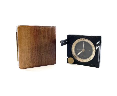 A 20th century brass lacquered compass by Stoppani in a fitted mahogany case, 9cm x 8.2cm.