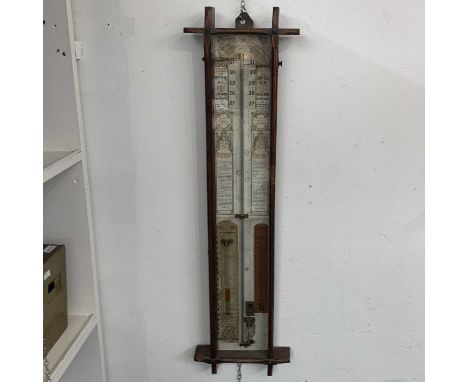 A Victorian oak cased Admiral Fitzroy barometer, with printed dials and scales, height 103cm.