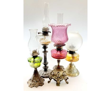 A Victorian cut glass oil lamp, raised on a plated pillar, height 51cm, together with a Victorian brass and cranberry glass o